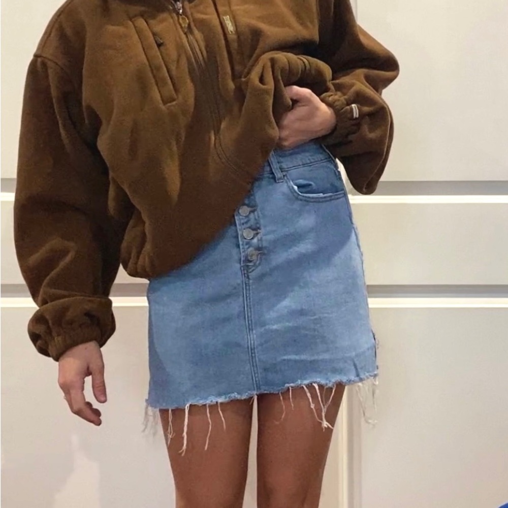 PacSun light wash jean skirt with button details and raw hem